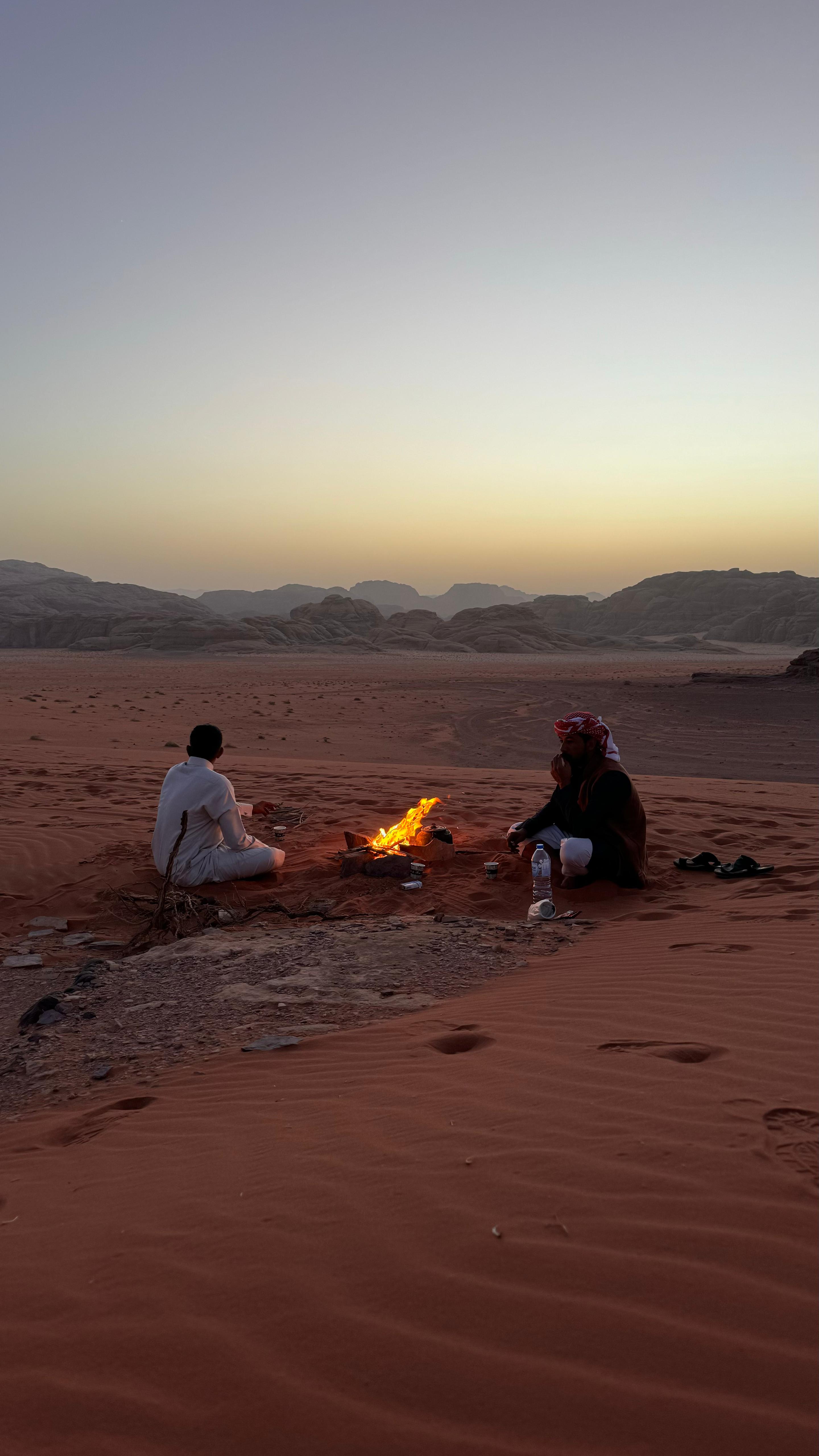 Omar by campfire at sunset